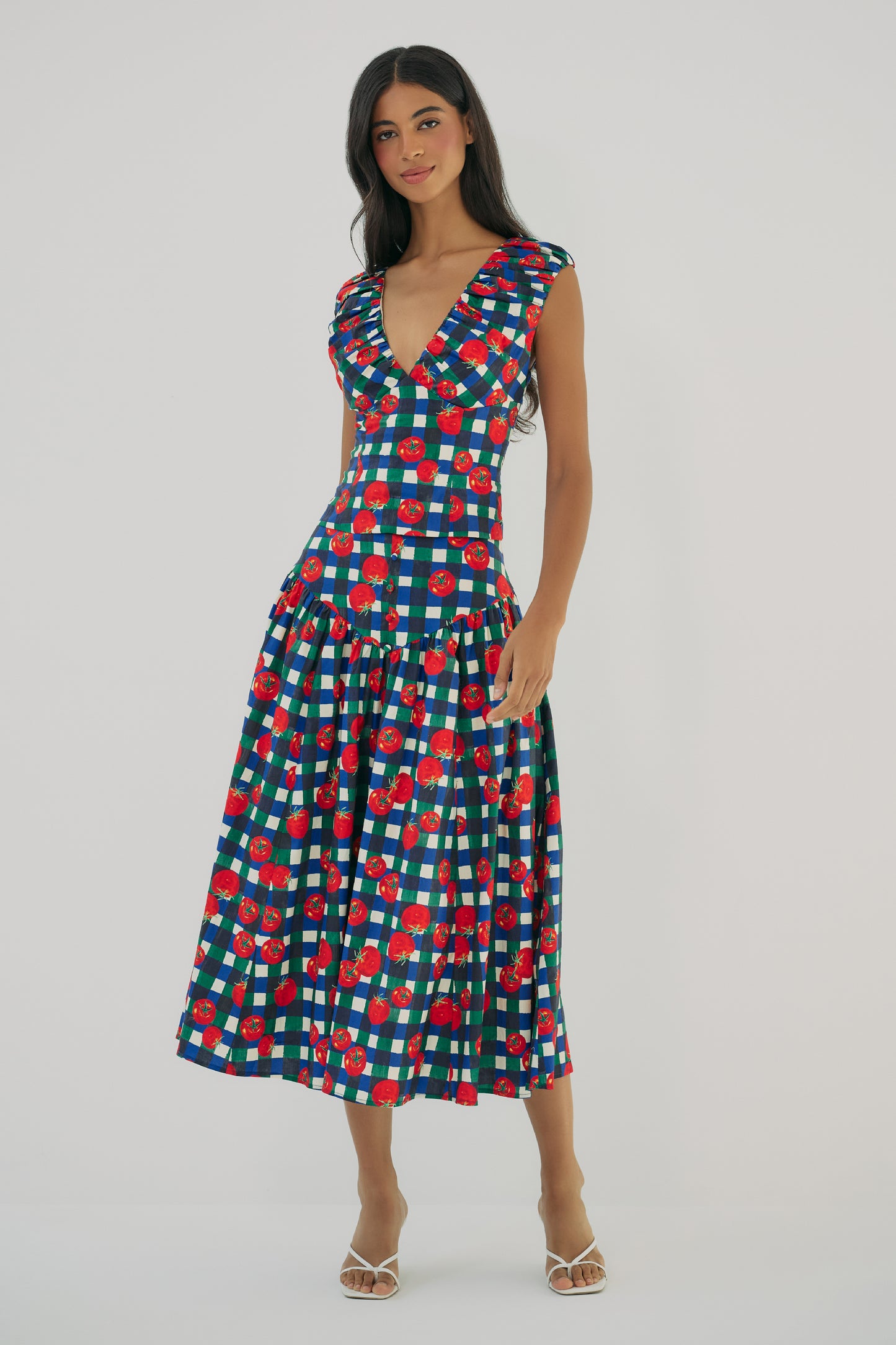 Model wearing Aiko V-neck top in gingham tomato print with fitted silhouette and deep neckline front view
