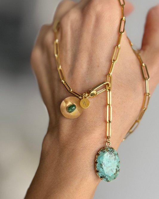 CITADEL Aventurine Ruby Zoisite Necklace draped over a hand showing the gemstone pendants and gold-filled chain