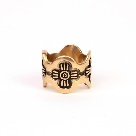 Front view of the Gladys Brass Bandana Slide Ring showing floral detailing and scalloped edges on a white background.