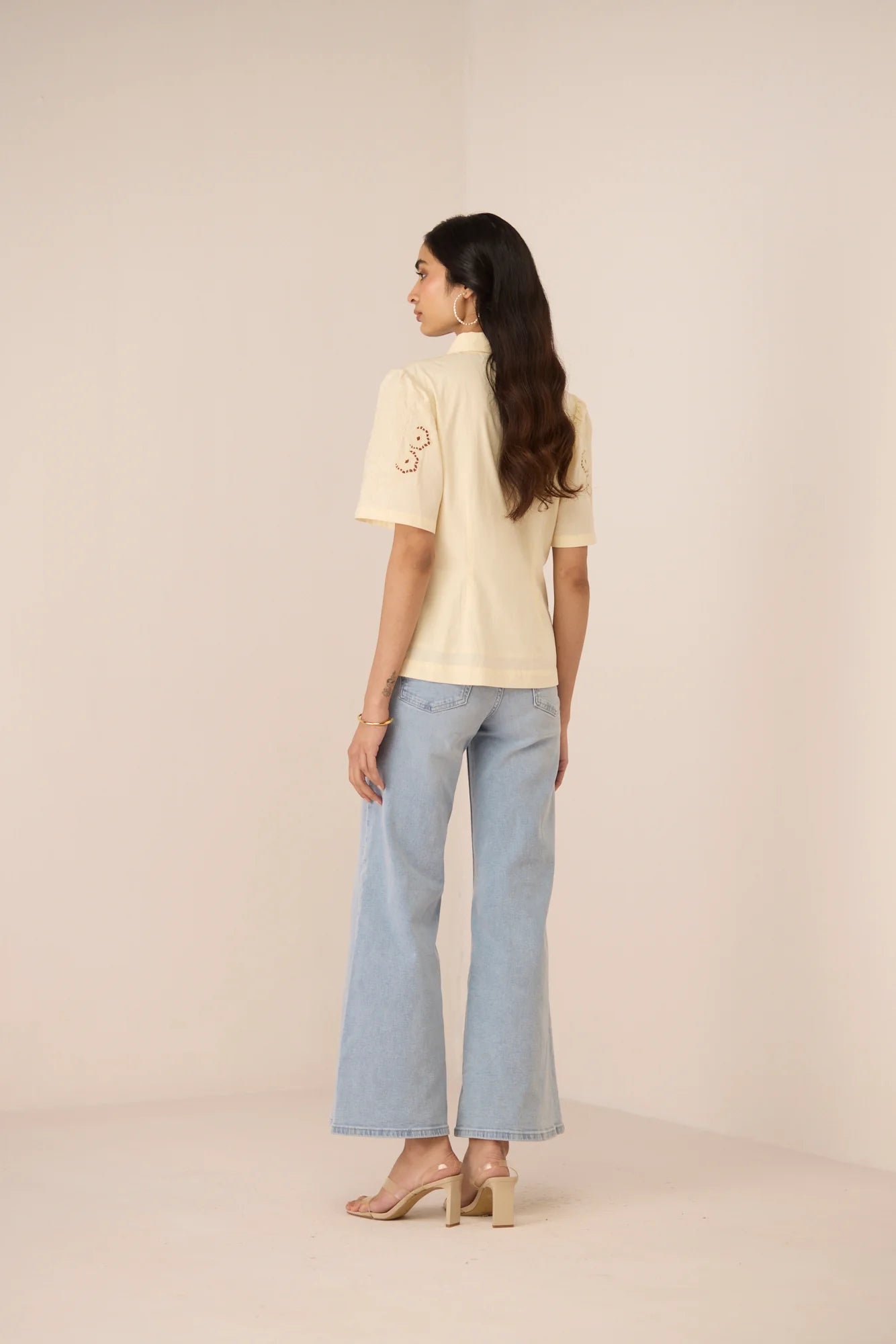 Full back view of the Hartley Shirt in cream cotton poplin with a relaxed fit and classic short sleeve shape.