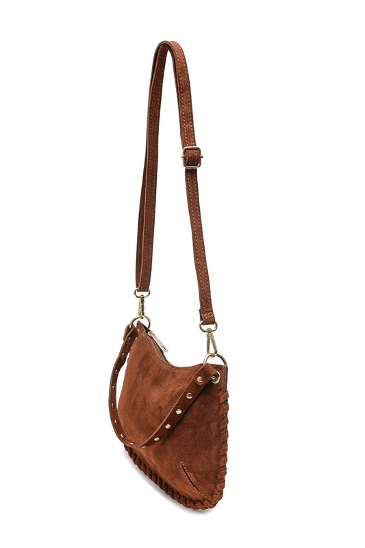 Side view of the Joelle Suede Bag in brown suede showing the adjustable shoulder strap and slim bag profile.