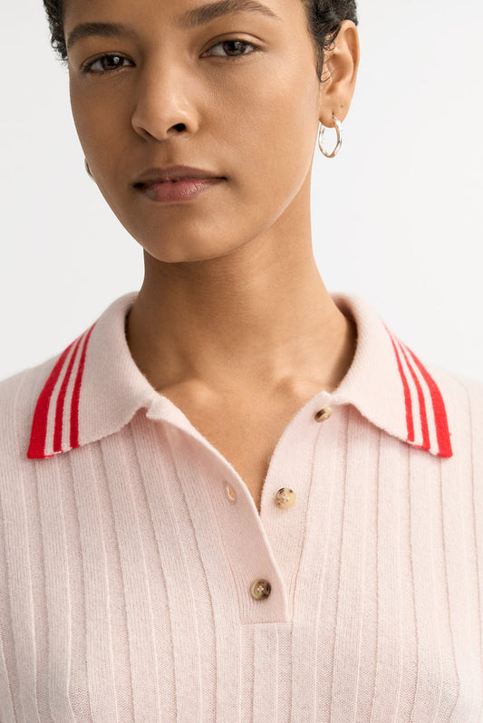 Close-up detail of the Striped Pique polo collar showing red and white striped accents, ribbed cashmere knit, and three-button placket.