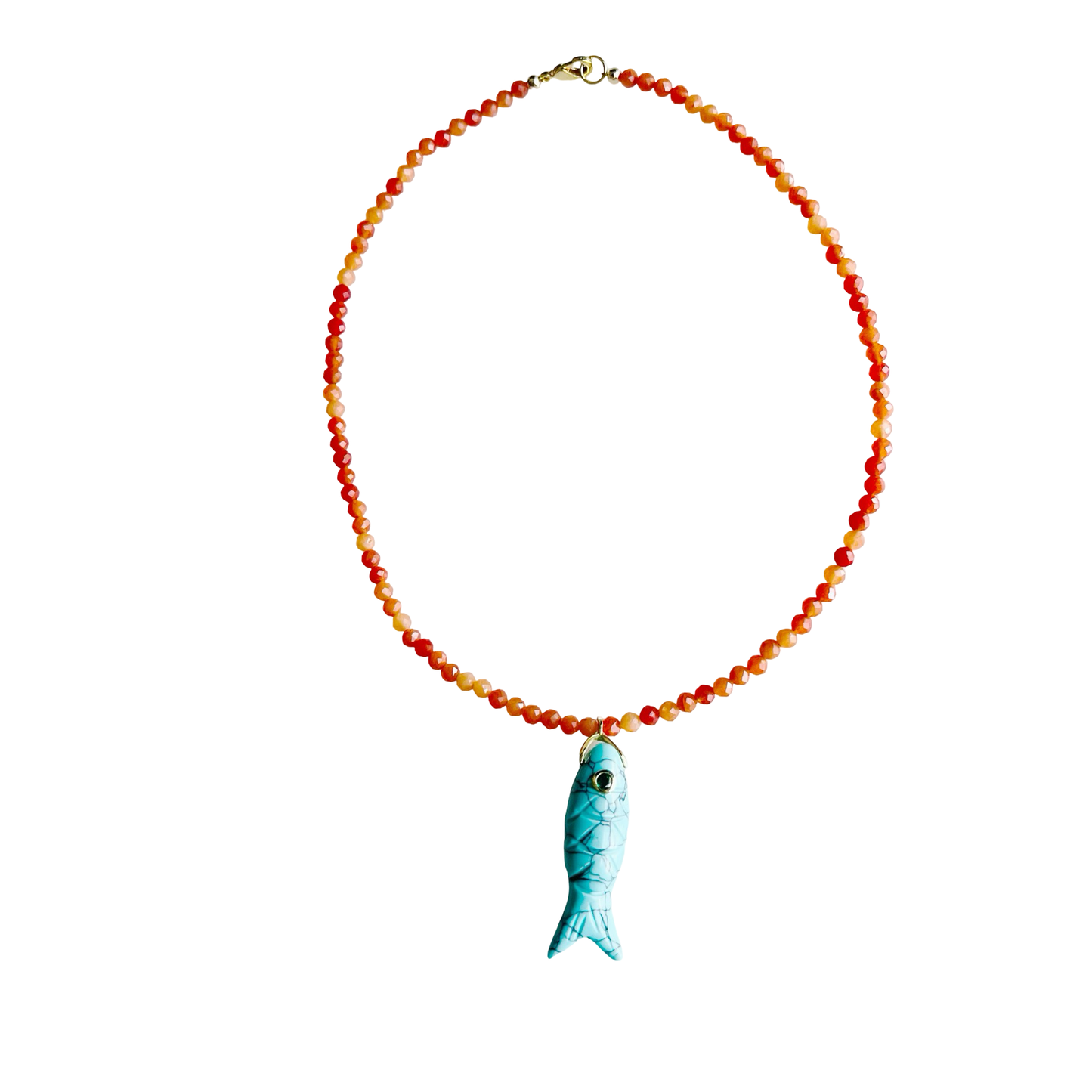The Big Eye Fish Necklace featuring orange jade gemstone beads and a carved turquoise fish pendant with a gem eye detail on a white background.