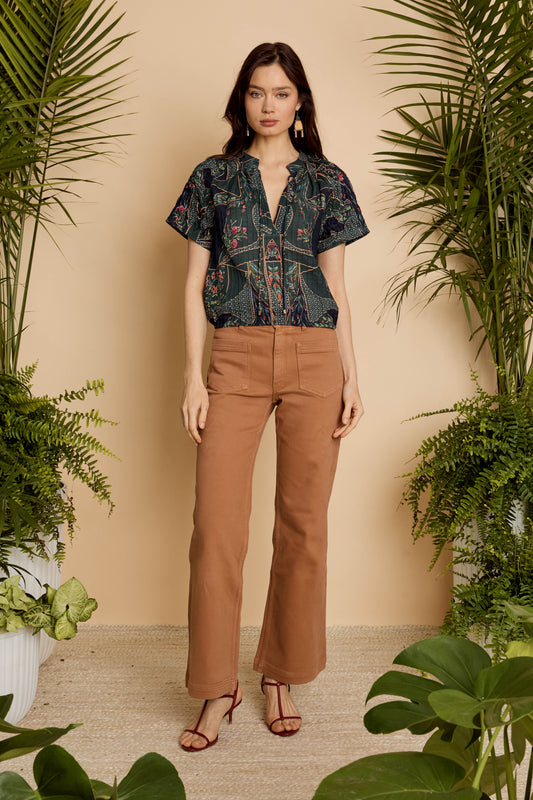Model wearing the Zola Top in Patchwork Flower with brown pants, front full-length view