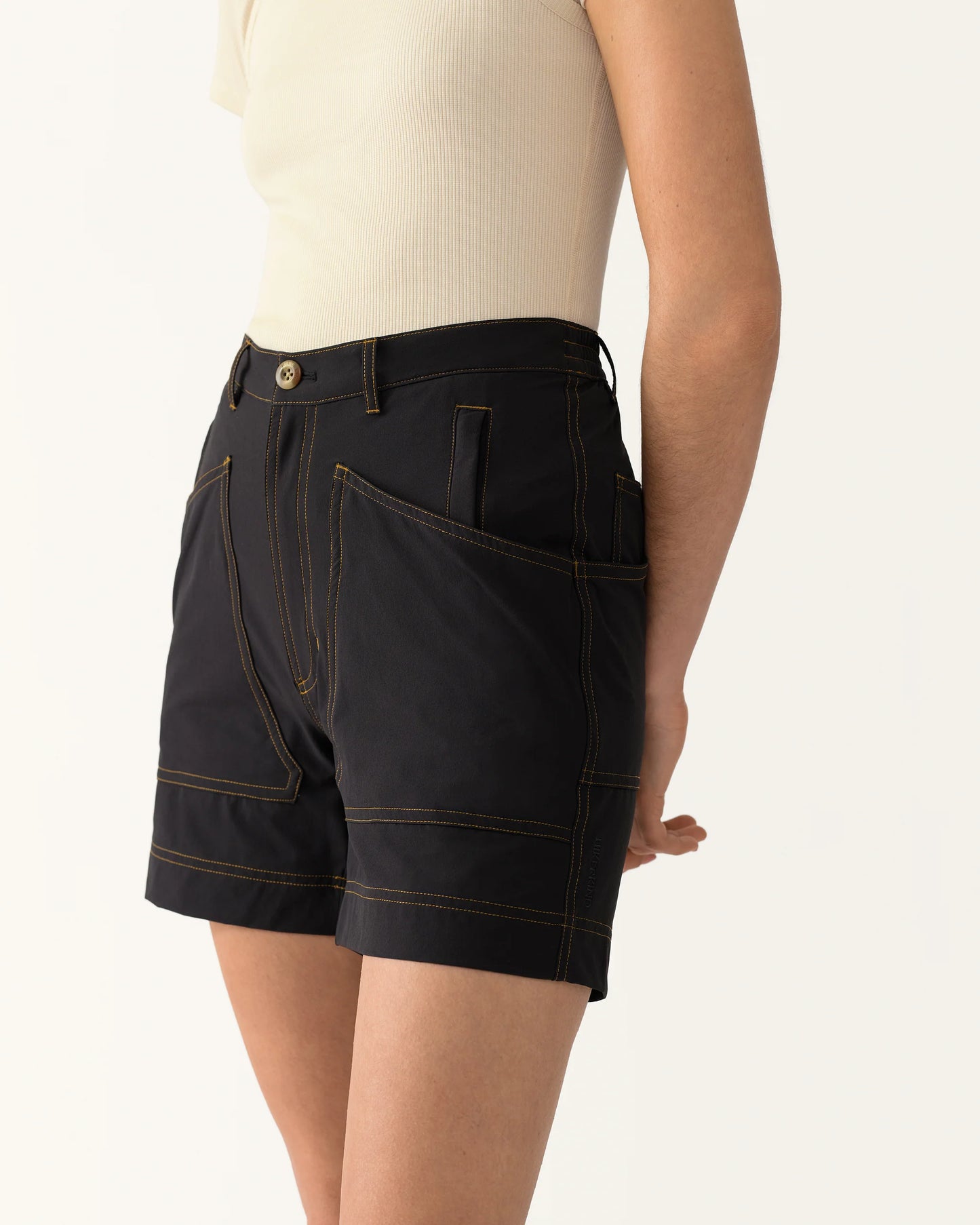 Side view of 8 Pocket Shorts in Basalt highlighting pocket structure and stitching detail