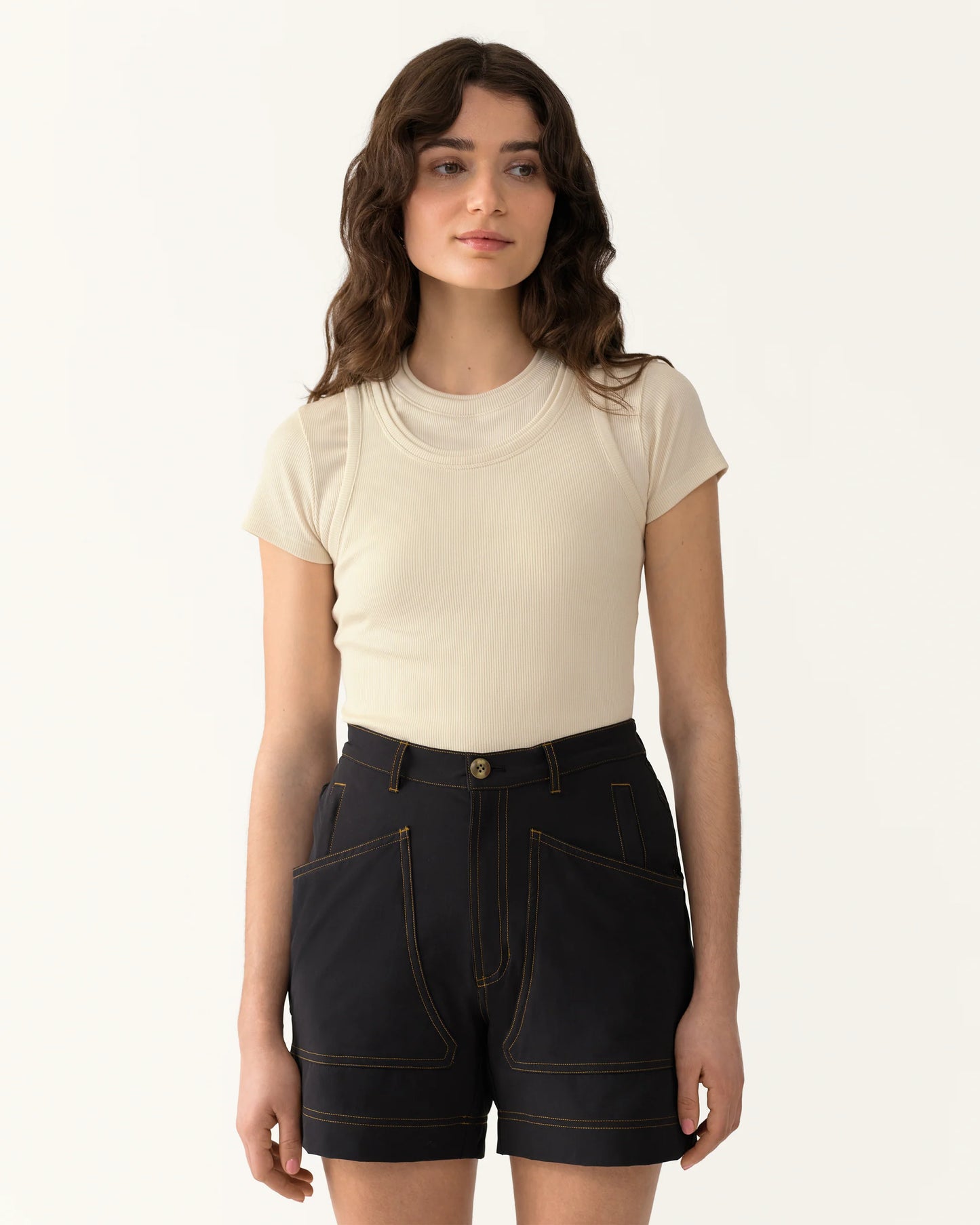 Close-up of 8 Pocket Shorts in Basalt showing button closure, belt loops, and front pocket design