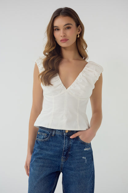 Aiko V-Neck Top in white, angled front view highlighting contoured fit and neckline