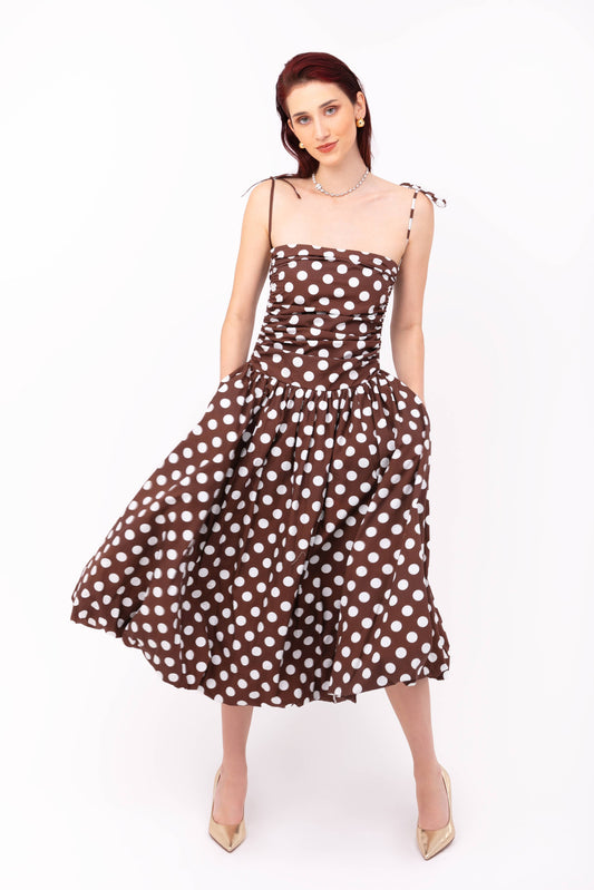 Alexa Brown Polka Dot Puffball Dress in brown and white polka dot print with a structured puffball midi silhouette and adjustable fit bodice