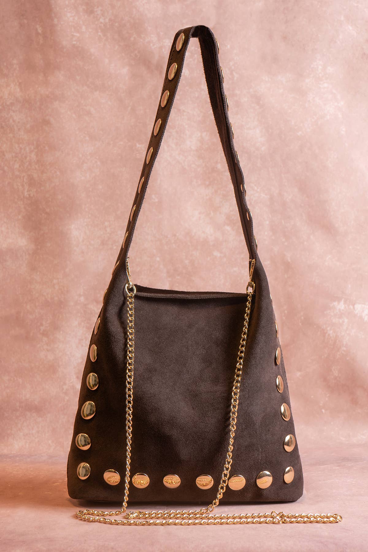 Back view of the chocolate suede Alexane Bag with its removable gold chain strap.