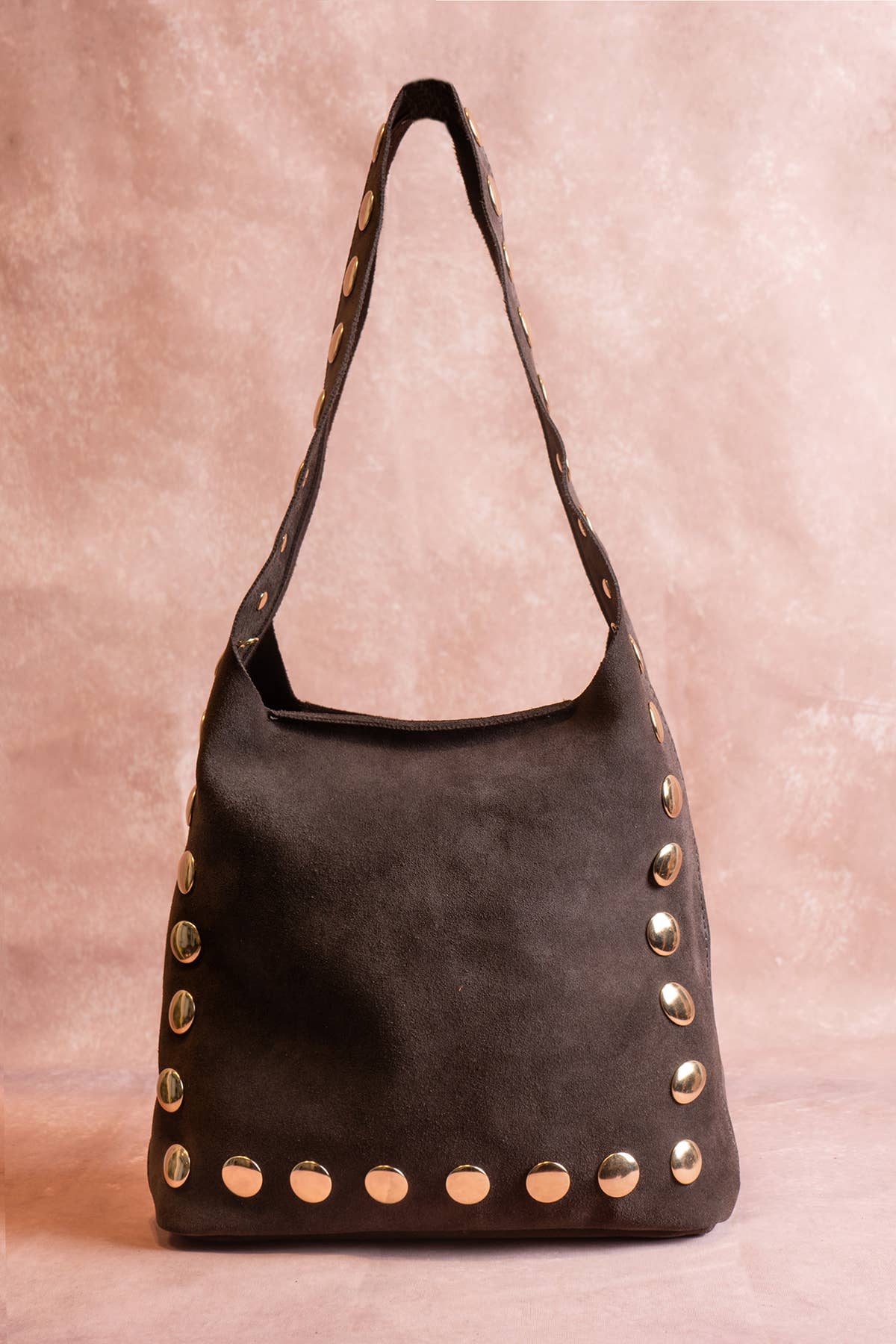Chocolate brown suede shoulder bag with gold stud detailing and a curved top handle.