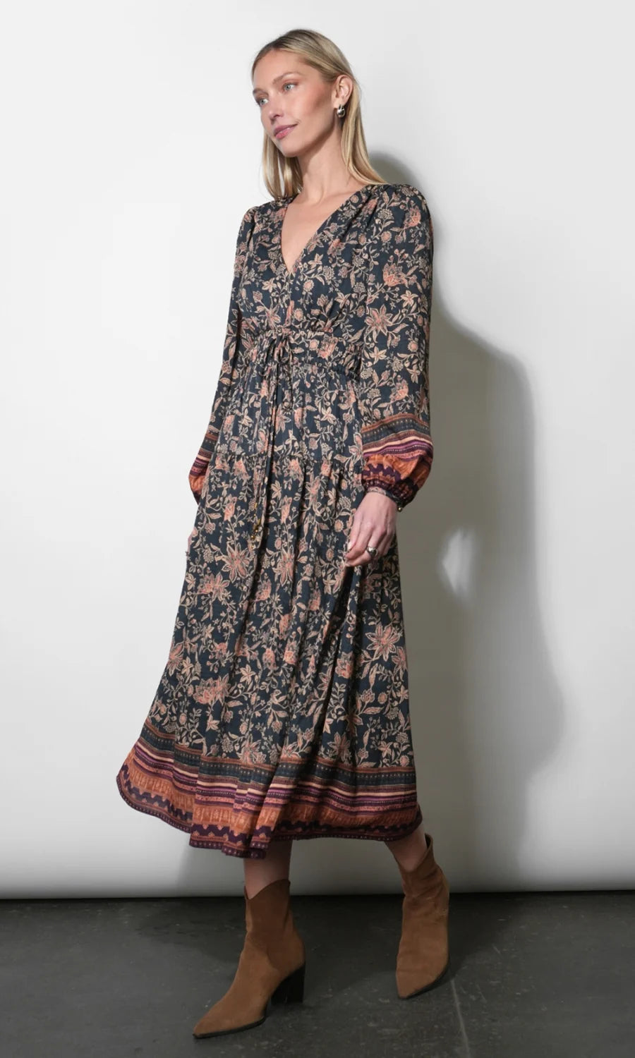 Side view of the Amber Boho Bordered Midi Dress in Navy showing its flowing silhouette and patterned border hem.