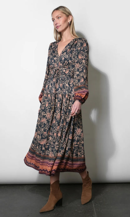 Side view of the Amber Boho Bordered Midi Dress in Navy showing its flowing silhouette and patterned border hem.