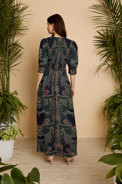Back view of the Aneta Dress in Patchwork Flower showing the smocked back bodice and flowing maxi silhouette