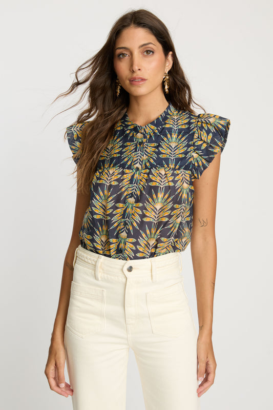 Front view of the Anthea Top in Deco Plume with a collared neckline, button-down front, flutter sleeves, and yellow tropical leaf print on dark blue fabric.