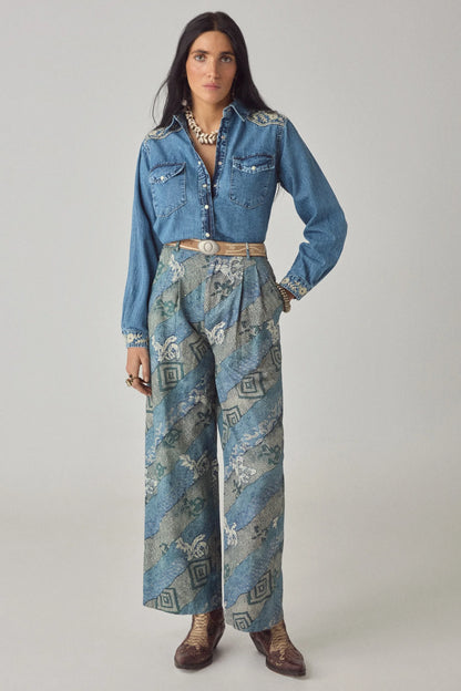 Full-length front view of the Arizona Thelma blue denim western shirt with floral embroidery and patterned wide-leg pants