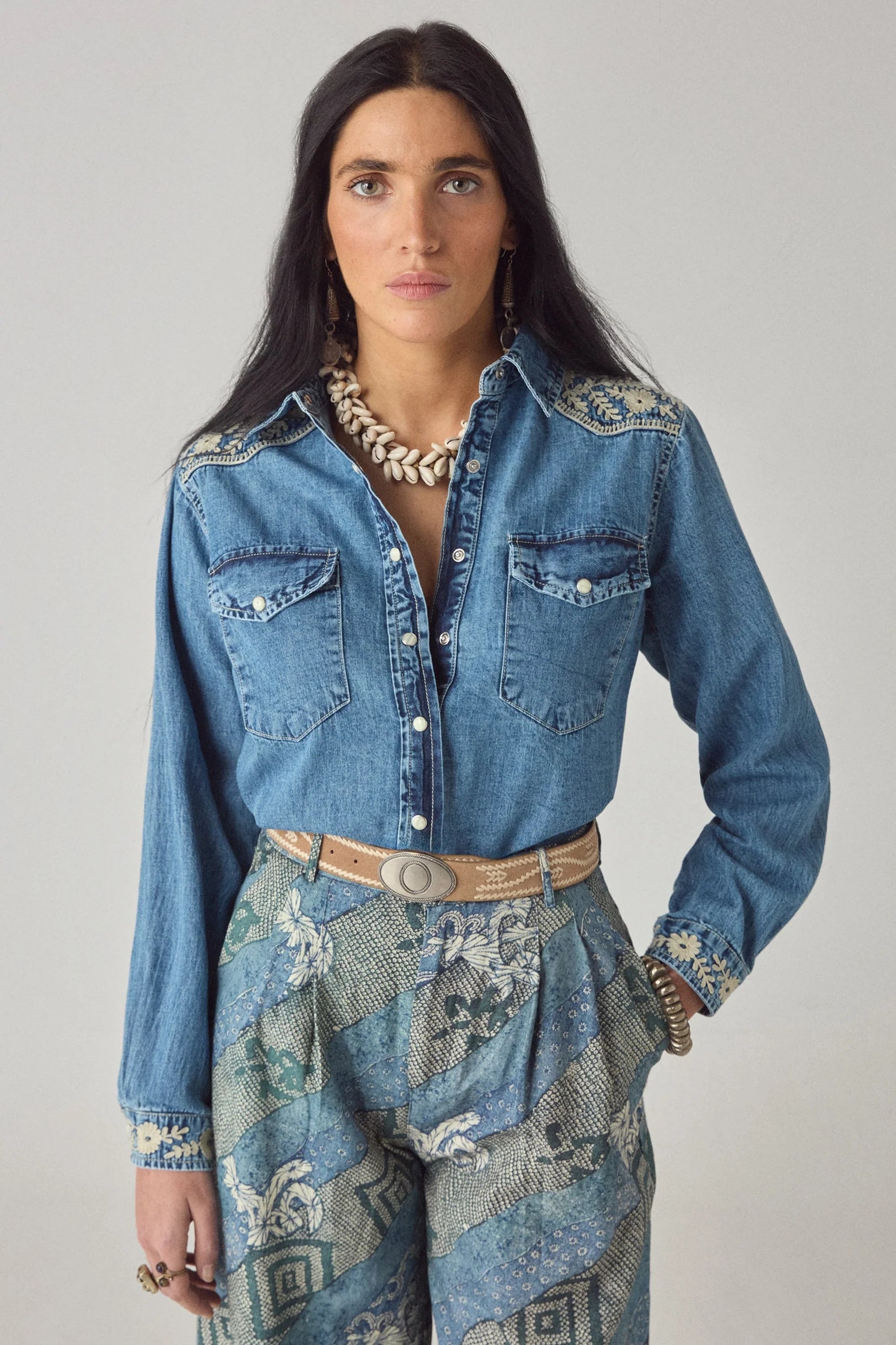Portrait view of the Arizona Thelma blue denim western shirt with embroidered shoulders and button-front design