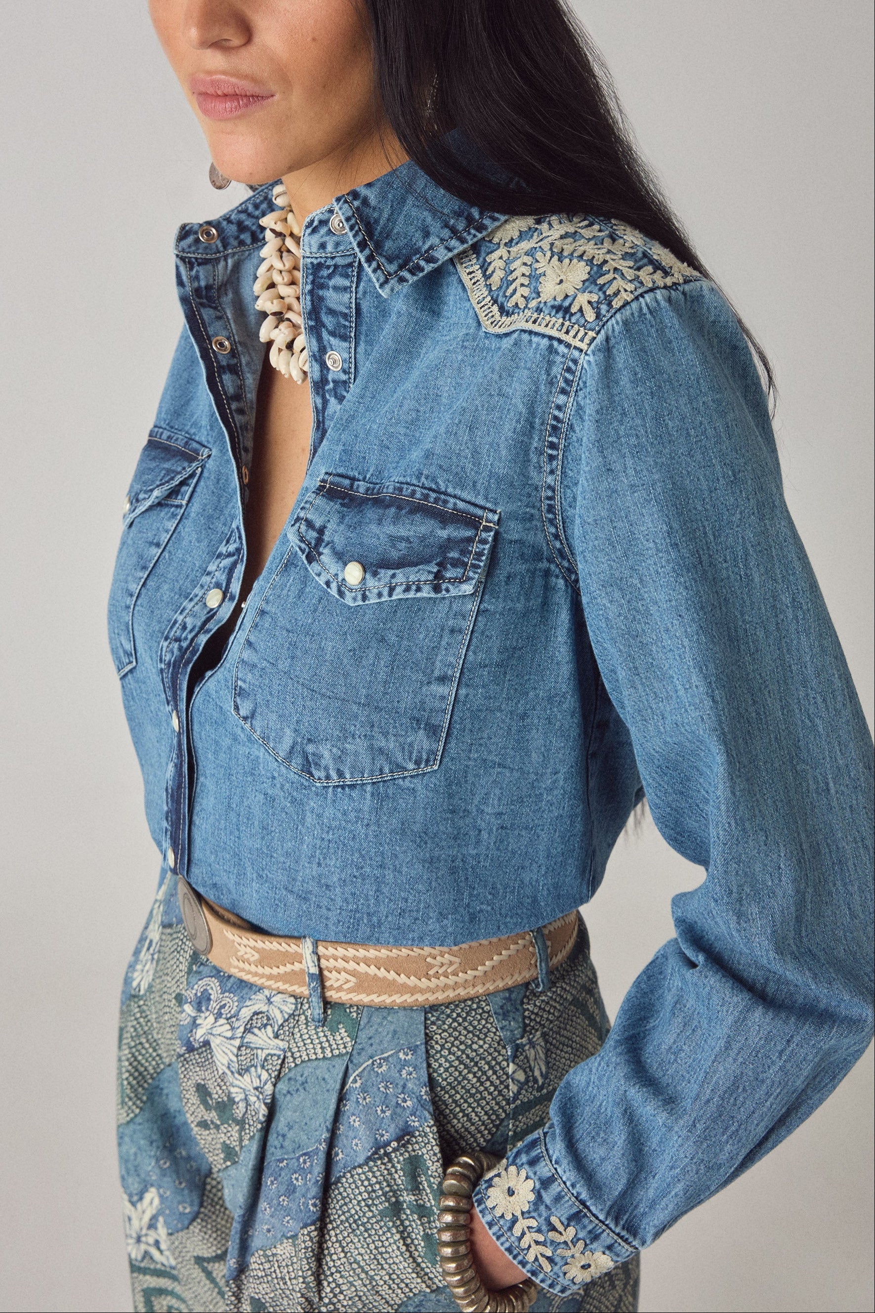 Side close-up of the Arizona Thelma embroidered denim western shirt with floral shoulder detailing and gathered cuffs