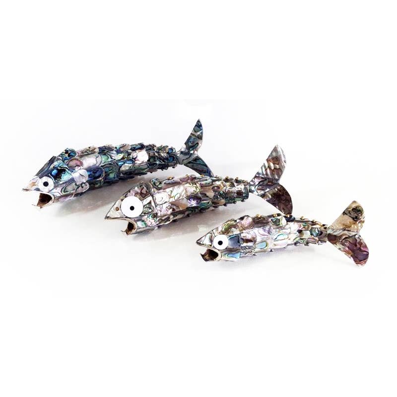 Three handcrafted articulated fish-shaped bottle openers featuring genuine Blue Pacific abalone shell inlay, displayed in assorted sizes with iridescent natural coloring and flexible segmented bodies.