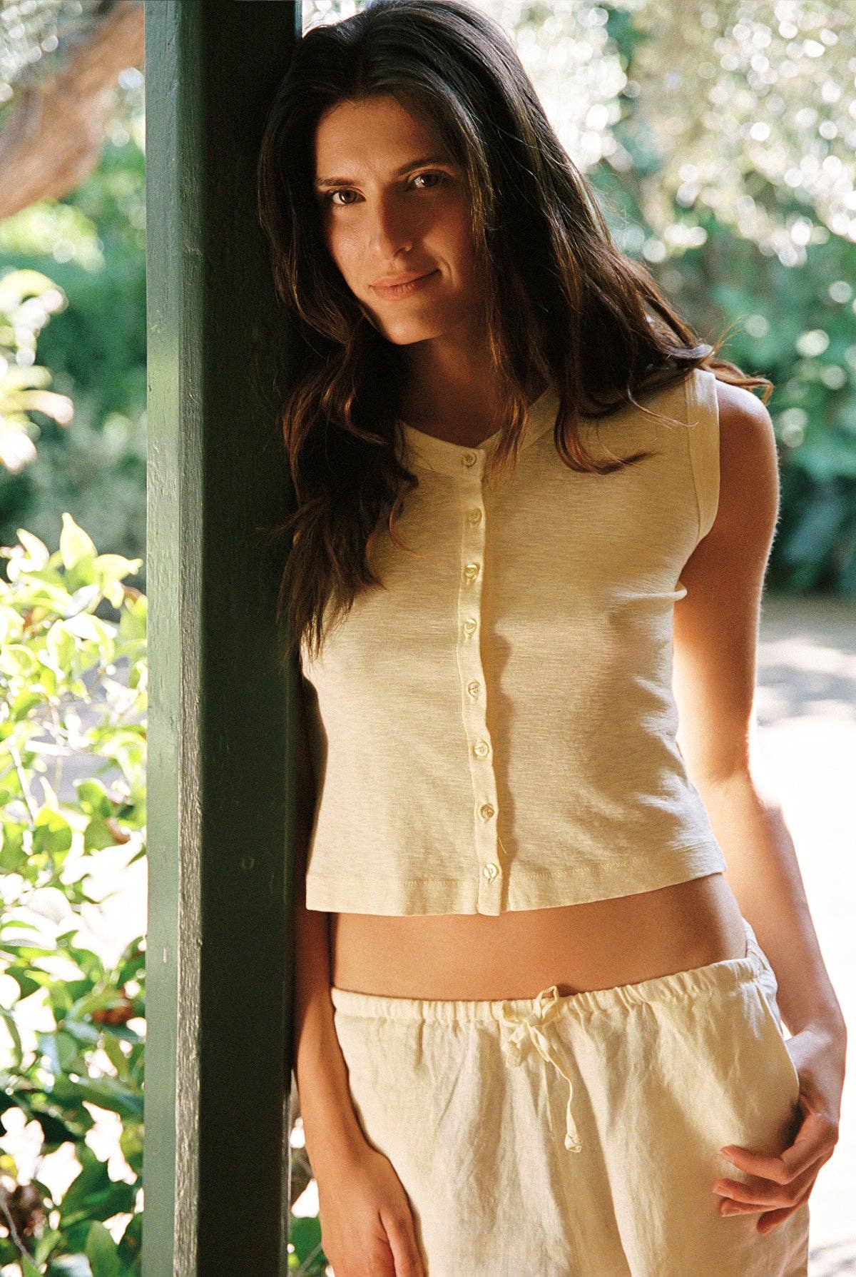 Close-up of the Auguste Slub Top in Butter, featuring a sleeveless cut, button-front detail, and textured organic cotton slub jersey.