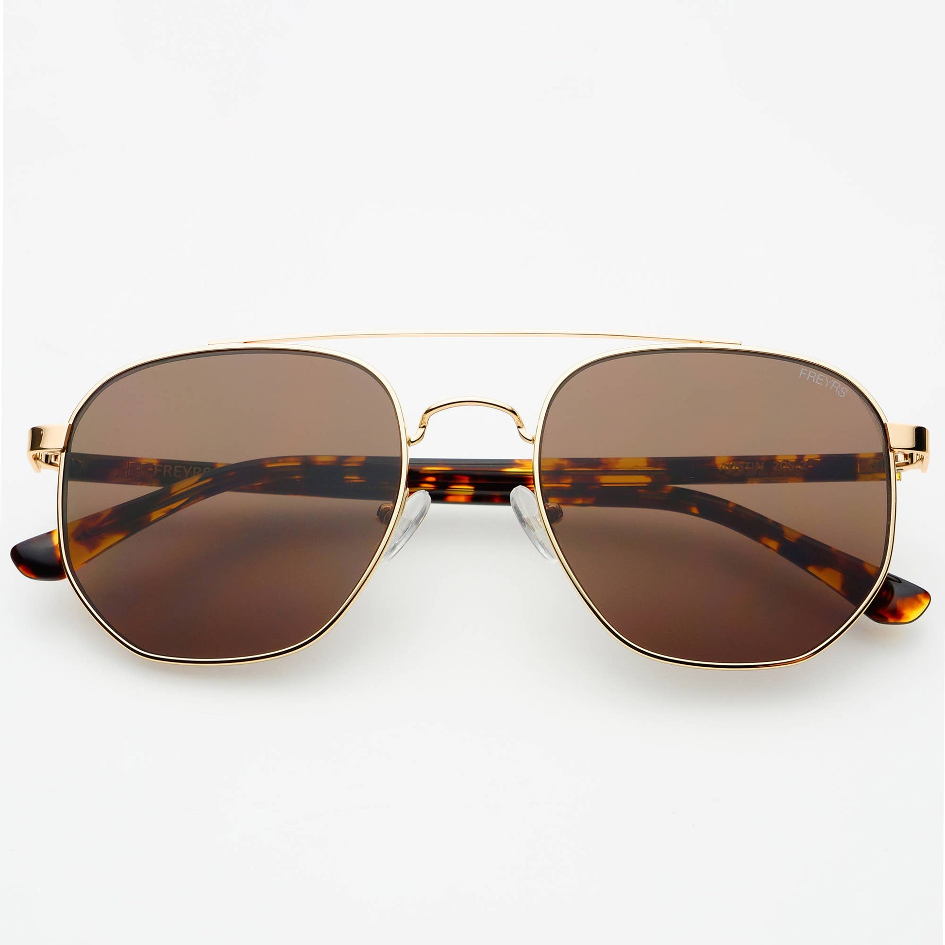 Austin Unisex Sunglasses in gold with brown lenses, shown from the front with tortoise acetate arms.