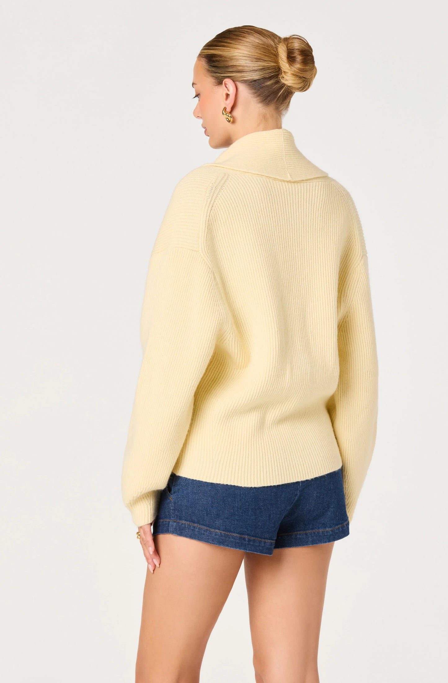 Back view of the Ayleen Ribbed Wrap Cardigan in Butter Yellow, showing the ribbed knit texture, long sleeves, and cropped length.