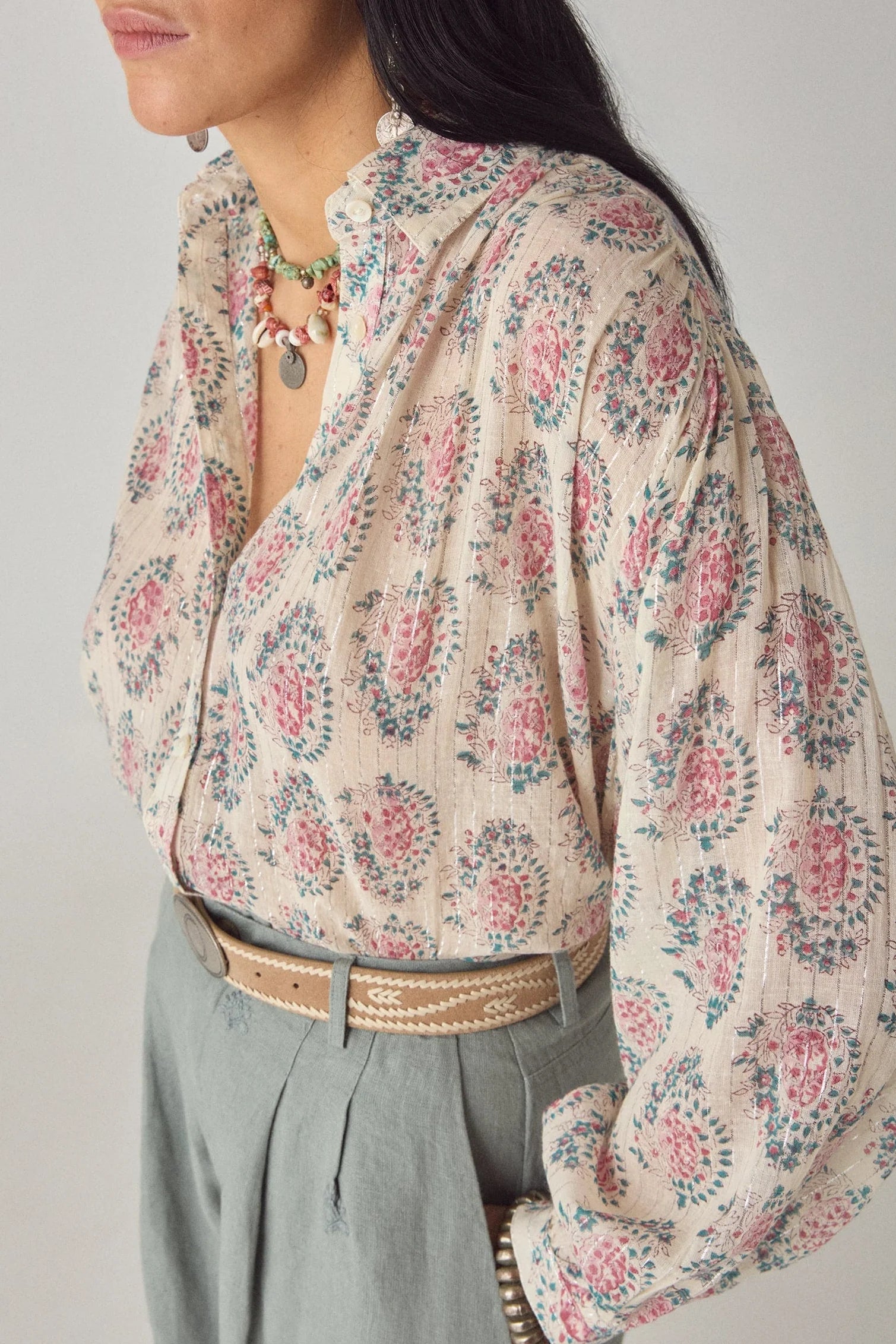 Close-up front detail of the Azalea Mary blouse featuring a pink and blue floral paisley print on soft lurex gauze fabric with subtle shimmer.