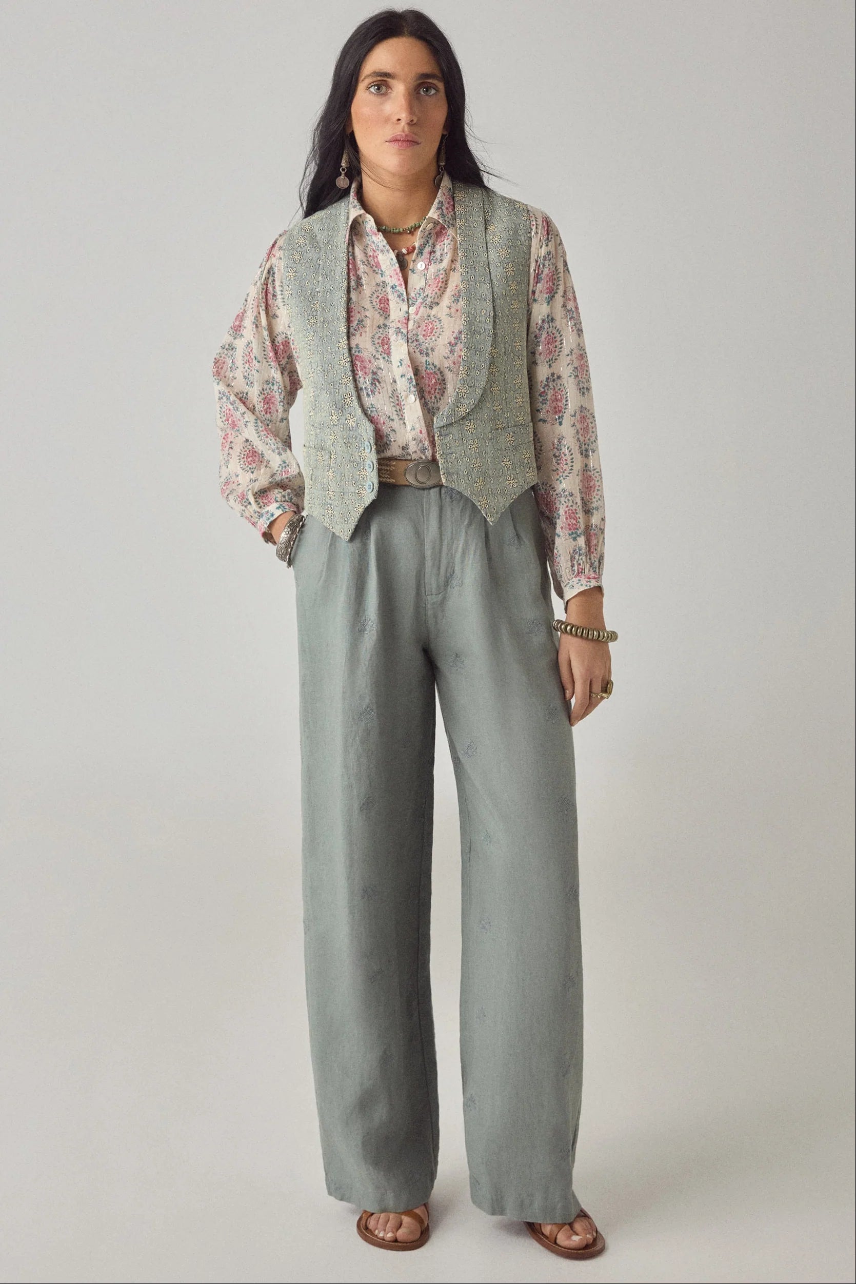 Model wearing the Azalea Mary blouse layered under a textured vest with sage wide-leg trousers for a relaxed bohemian look.