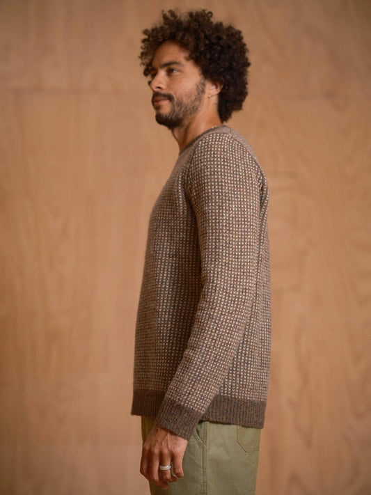 Side view of model wearing the Beacon Sweater in Walnut with ribbed cuffs and hem.