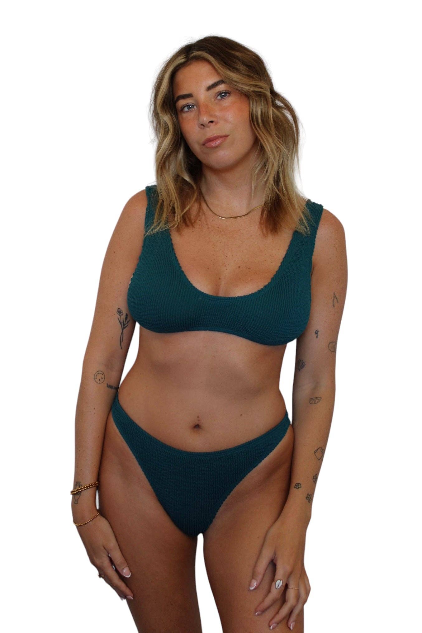 Model wearing the Becca Bottom in Mermaid with matching ribbed swim top, shown from the front.