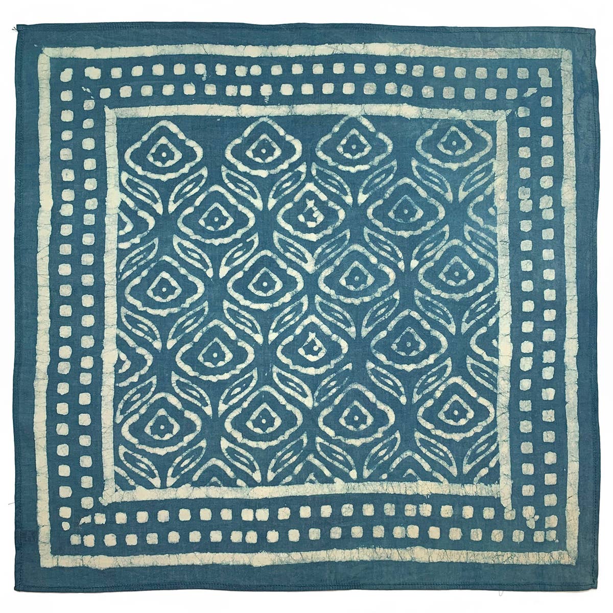 Square indigo cotton bandana featuring a hand block printed floral leaves motif framed by a geometric square border. Crafted from lightweight, ultra-soft cotton using traditional block printing techniques and eco-friendly dyes.