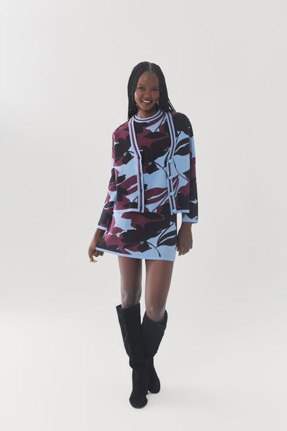 Front view of the Brook Cardigan styled over a coordinating floral knit mini dress.
