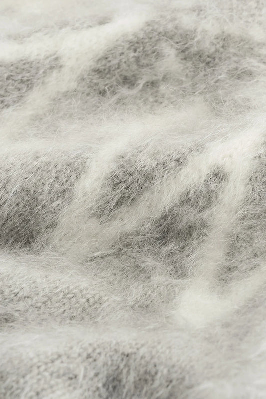 Close-up of the soft brushed cashmere and white Fair Isle jacquard knit pattern.