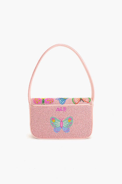 Full front view of the Butterfly Garden Beaded Shoulder Bag with a colorful butterfly design, pink flap closure, and matching shoulder handle.
