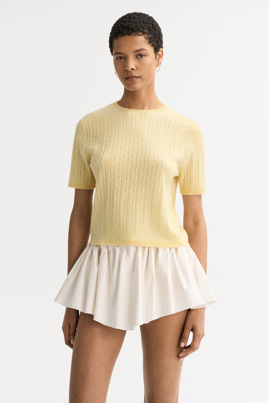 Front View
Front view of the honeydew yellow cable knit cashmere top with short sleeves and fitted silhouette