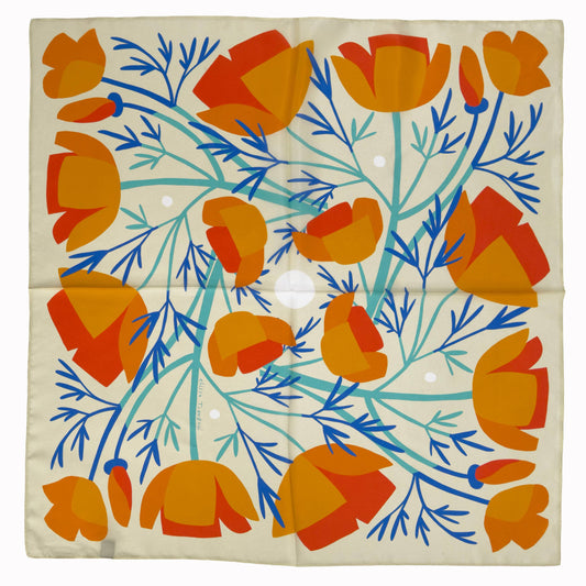 California Poppies 100% silk scarf laid flat, featuring orange poppies with blue and green botanical stems on a warm neutral background.