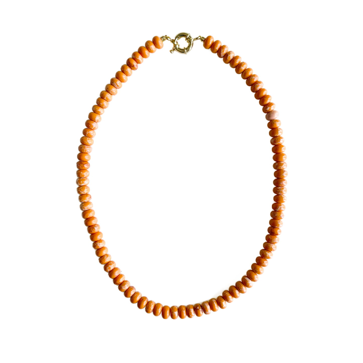 Orange jasper gemstone bead necklace with an 18kt gold plated clasp on a white background.
