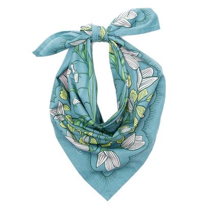 Cassie teal floral cotton bandana tied into a scarf shape, showing the botanical floral print and finished edges.