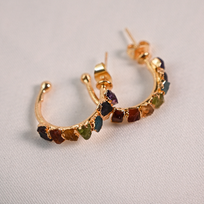 Pair of gold-plated chakra hoop earrings featuring amethyst, turquoise, aventurine, carnelian, and jasper stones.