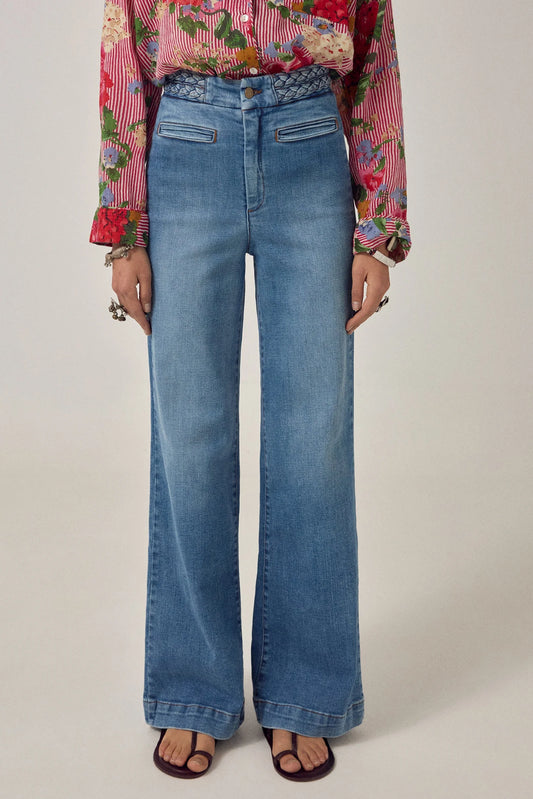 Front detail of the Cher Pant in Braid Denim showing the braided waistband, tailored front pockets, and soft stretch denim finish.