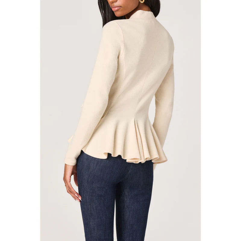 Close-up back view of the Dayna cream knit wrap top featuring a soft flared peplum hem and fitted silhouette