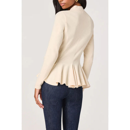 Close-up back view of the Dayna cream knit wrap top featuring a soft flared peplum hem and fitted silhouette