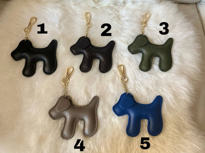 Blue 5 dog-shaped keychain crafted from genuine cobalt blue leather with a light gold-tone clasp and chain, made in Italy.