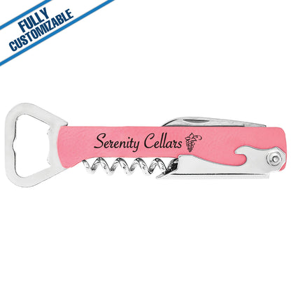 Pink engraved leatherette bottle and wine opener with stainless steel corkscrew, bottle opener, knife, and custom Serenity Cellars logo.