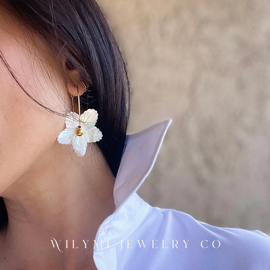 Model wearing FLOWER CHILD Drama Hoops with hand-carved mother-of-pearl flowers and gold-filled hoops