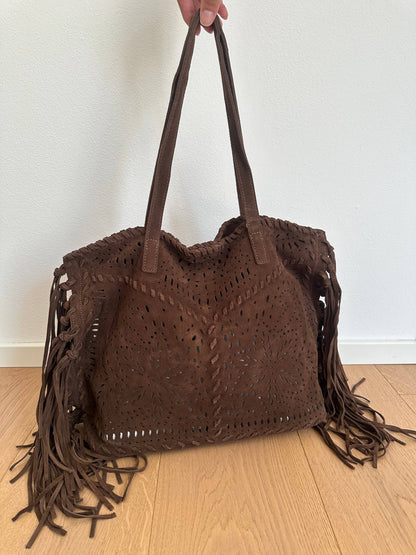 Farah dark brown suede fringe shoulder bag shown at an angle with double handles and decorative perforated detailing.