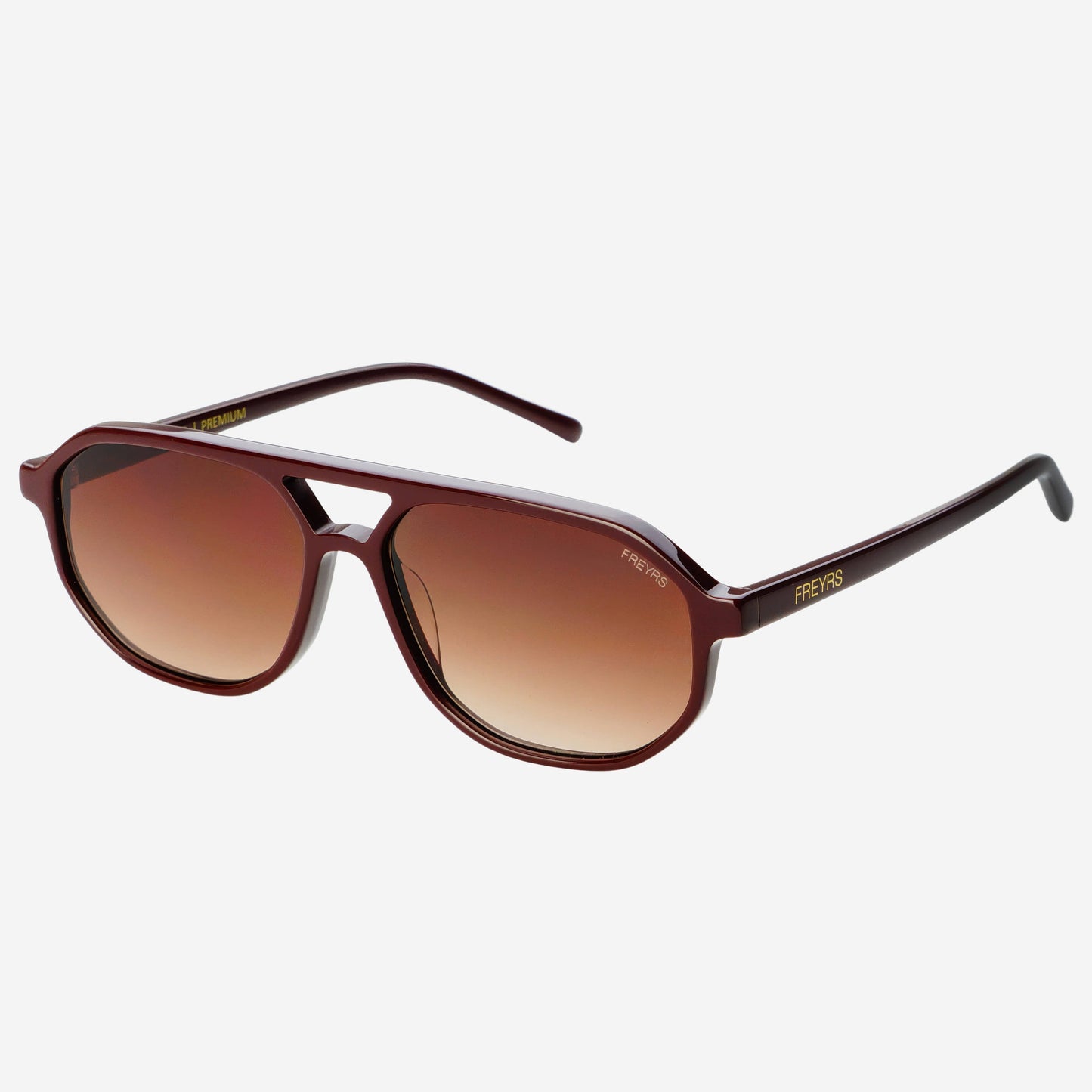 Angled view of Fenix aviator sunglasses in chocolate acetate with brown gradient lenses and slender metal temple details.