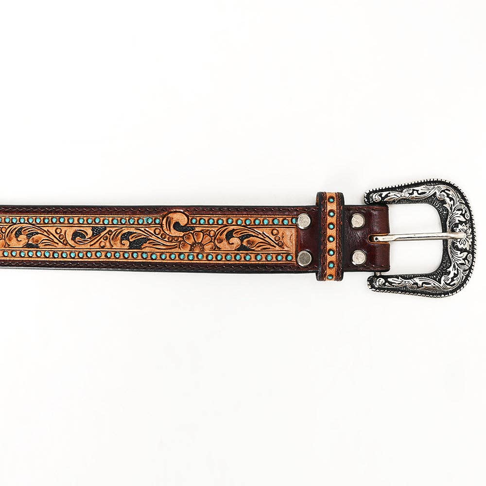 Close-up of engraved silver-tone buckle and turquoise stud detailing on a hand-tooled western leather belt.