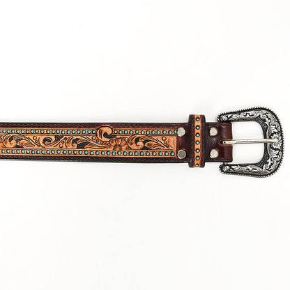 Close-up of engraved silver-tone buckle and turquoise stud detailing on a hand-tooled western leather belt.