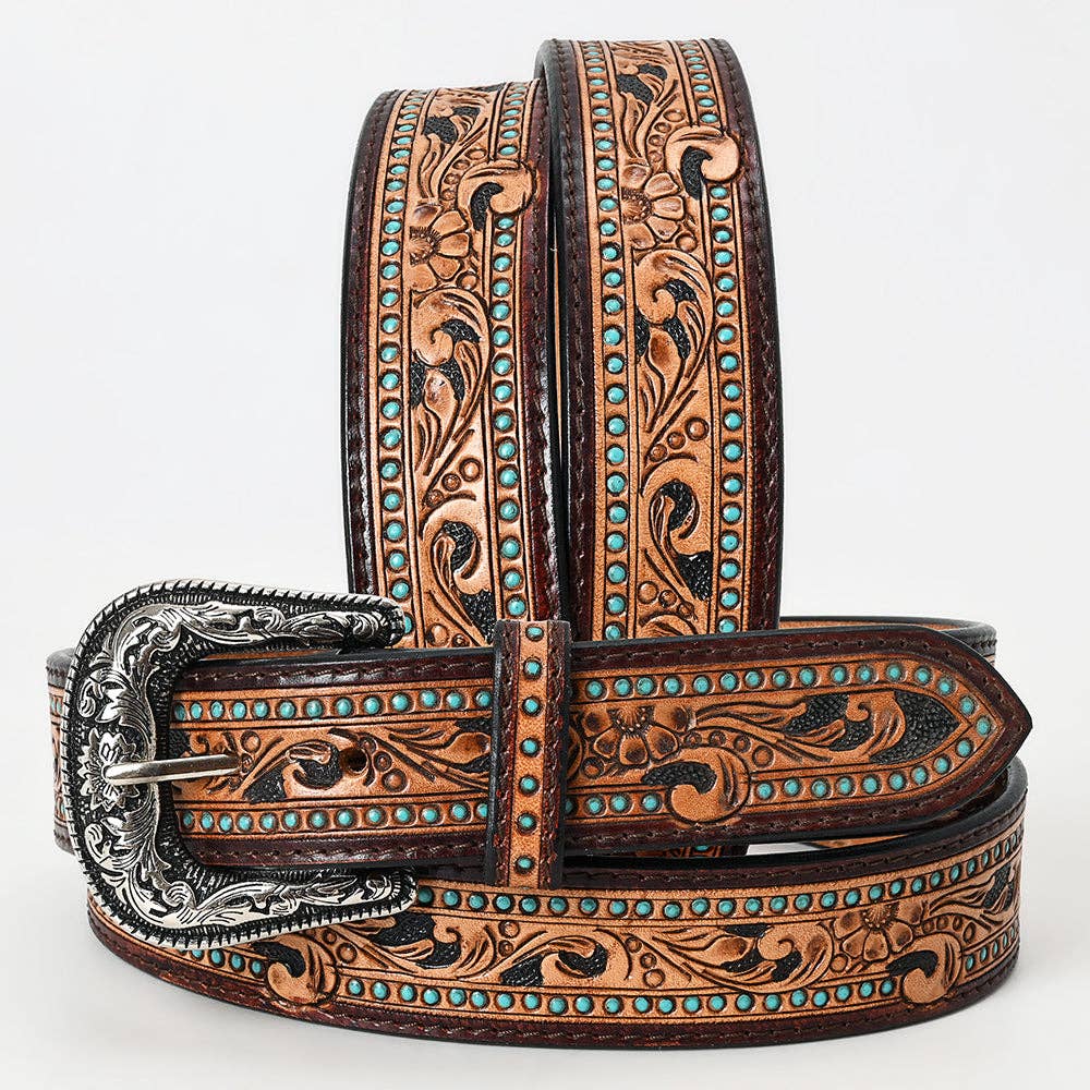 Tooled western leather belt with floral scroll pattern, turquoise stud accents, and engraved silver-tone buckle displayed in a wrapped styling view.