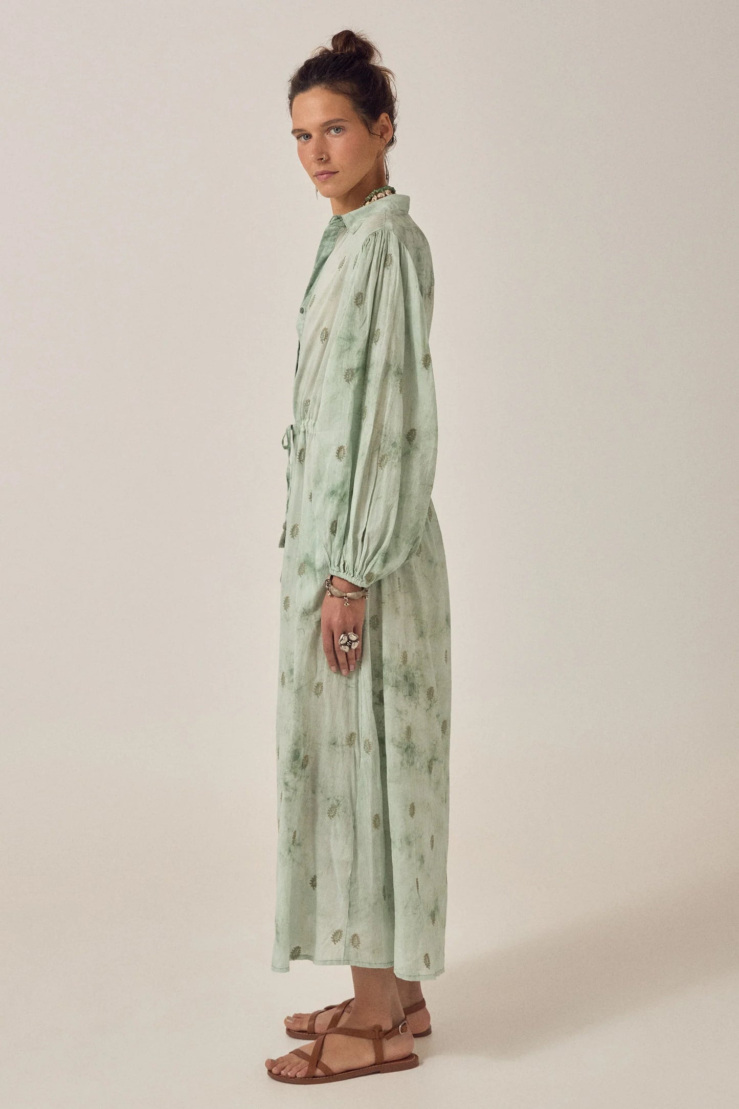ide profile of the Freya Dress in Mineral Waves showing the flowing cotton voile fabric, full-length silhouette, and softly gathered sleeves.